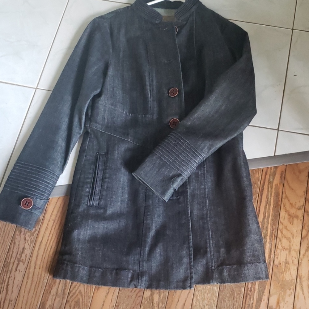 Mid thigh length Indigo Palms denim jacket.